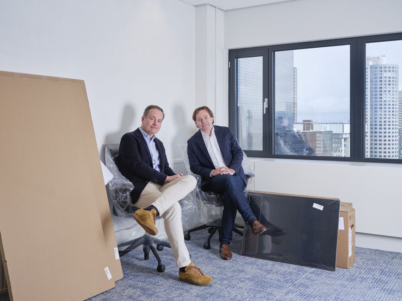 Jeroen Kelder (links) en Jan-Willem Muller in hun nieuwe kantoor aan het Weena in Rotterdam.