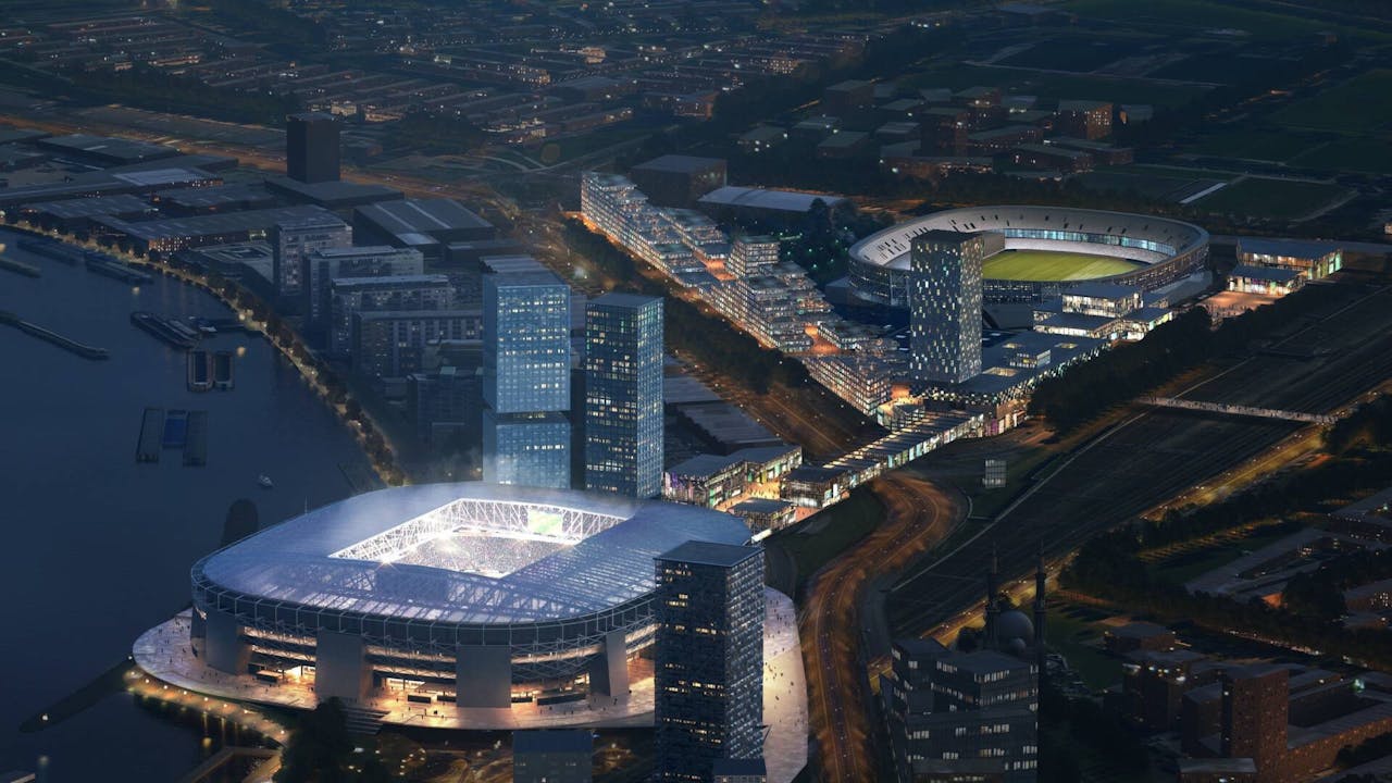 Impressie van het nieuwe (voorgrond) en oude stadion in de avond