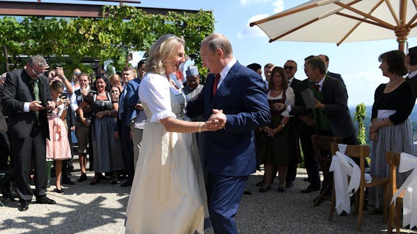 Austria's Foreign Minister Karin Kneissl dances with Russia's President Vladimir Putin at her wedding in Gamlitz, Austria, August 18, 2018. Roland Schlager/Pool via Reuters TPX IMAGES OF THE DAY